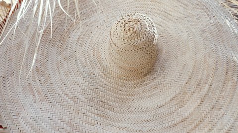 Authentic Moroccan straw hat in the Medina of Marrakech (Marrakesh), Morocco. Traditional handmade, tourist souvenir. 4k Texture background footage. 