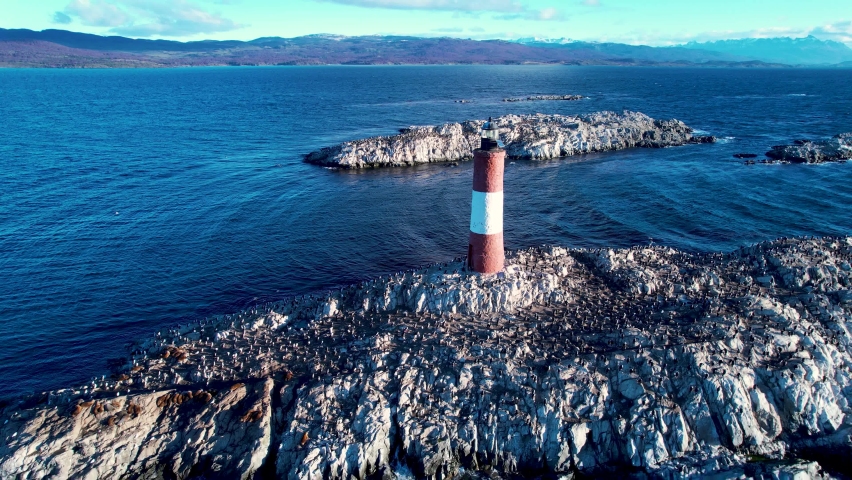 Ushuaia Patagonia Landscape. Famous lighthouse of Ushuaia City at Beagle Channel near Chile border. Patagonia Argentina. Called of End of the World – Fin Del Mundo – Lighthouse. Ushuaia Argentina.  Royalty-Free Stock Footage #1089845451