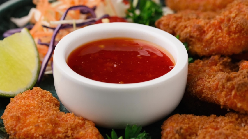 Dipping Crispy Prawns in sweet chilli sauce Royalty-Free Stock Footage #1089850139