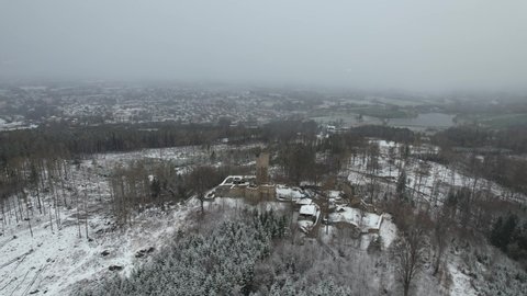 Snowing above scenic landscape with medieval Castle Orlík by Humpolec city, Vysočina-Highlands, Czech republic, aerial panorama view with a snow storm comming,white out