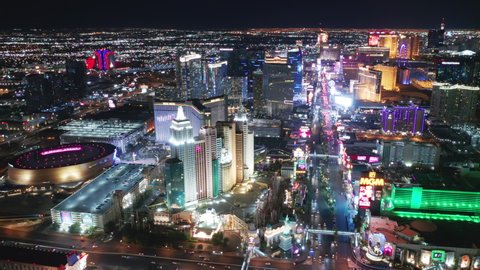 Las Vegas Strip Nevada, Apr. 2022. Cinematic aerial of scenic New York hotel with Liberty Statue and roller coaster at night illumination. Entertainment gambling capital with 5-stars casino resorts 4K