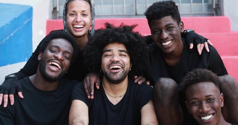Group of young multiracial people smiling on camera outdoor 