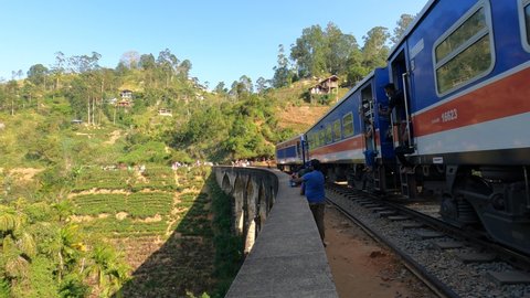 Ella, Sri Lanka - February 27 2022: A train passing through Nine 9 Arch Bridge made by British in Ella Srilanka Trains in Sri Lanka