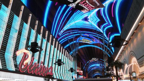 Las Vegas, Nevada - december 5, 2019: Amazing huge signs with lots of spotlights illuminating casino signs on traditional las vegas streets on a quiet night