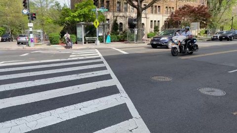 WASHINGTON, DC – APR. 22, 2O22: Motorcycle police officer responds to scene of active shooter in Van Ness neighborhood of NW Washington, DC.