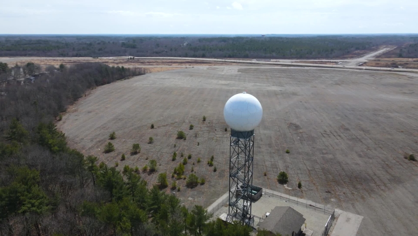 Weather radar, aerial drone shot around a weather detection turret next to a forest. Royalty-Free Stock Footage #1089860711