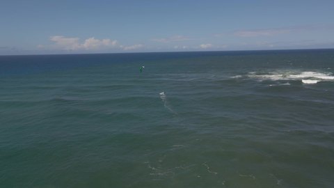 Kitesurfer Surfing Across The Sea In Summer. Duranbah Beach In Tweed Heads, NSW, Australia. aerial drone