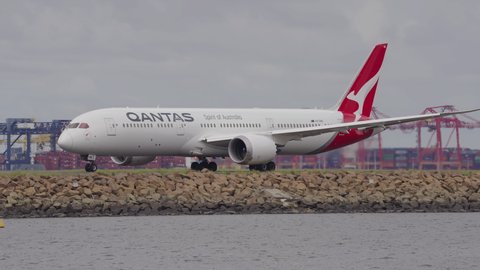 Sydney, Australia - Mar 26, 2022: Qantas airplane turning on runway of Sydney Airport