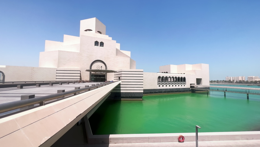 DOHA, QATAR - 2022: Building of Museum of Islamic Art surrounded by emerald waters of Persian Gulf.