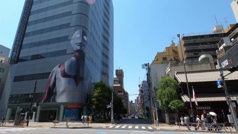 Asakusa, Tokyo, Japan - May 2 2022: A life size image of Ultra Man of the Bandai building in Asakusa advertising the movie "Shin Ultra Man".