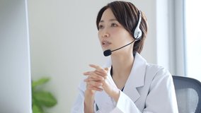 Asian female doctor working at the hospital