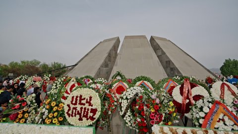 Armenia, Yerevan, The Armenian Genocide Memorial, April 24, 2022 -Low angle stabilized wide shot of the Armenian Genocide Memorial surrounded by flowers