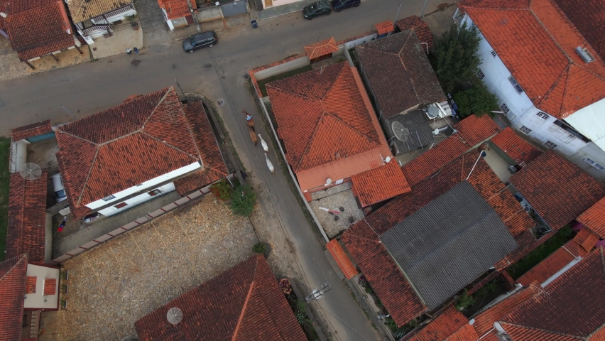 Horse Carriage Riding along Old Historical Town with Tiled Roffs. Aerial View