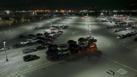 Tesla factory, Fremont, USA Feb. 2022. Aerial view of facilities for series production of energy efficient vehicles. Huge parking lot with brand new green energy cars. High quality 4k footage