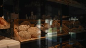 Showcase shelves with fresh pastries in the bakery. Fresh hot bread and buns.