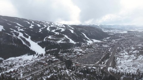 Keystone Town and Ski Resort, Colorado USA in Winter Season, Aerial View of Cityscape and Snow Capped Hills and Ski Tracks