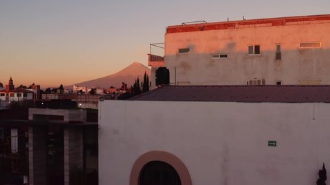 Sunset aerial over heavily populated Cholula Mexico