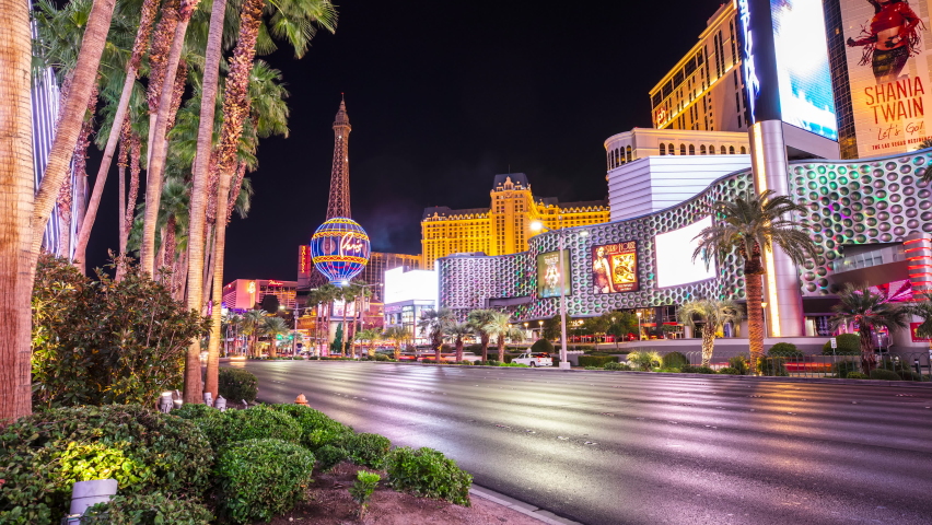 Las Vegas, Nevada - December 9, 2021: A Timelapse of traffic racing up the Las Vegas Strip in front of the Paris and Planet Hollywood Hotel Casinos on Las Vegas Boulevard in Las Vegas, Nevada.