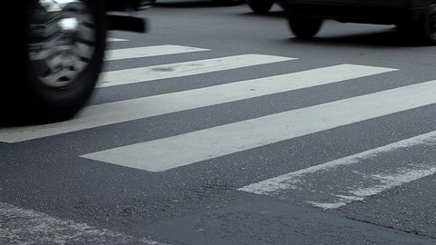 Zebra Crossing and Traffic on a Street in Buenos Aires, Argentina, South America. Low Angle View.  