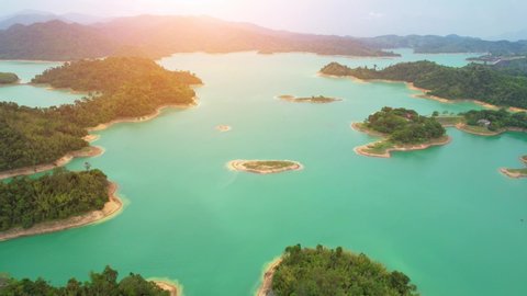 A drone flying over a dam in a beautiful tropical forest. top view. Ratchaprapha dam, Surat Thani Province, Thailand. Aerial view 4K. cinematic drone shots
