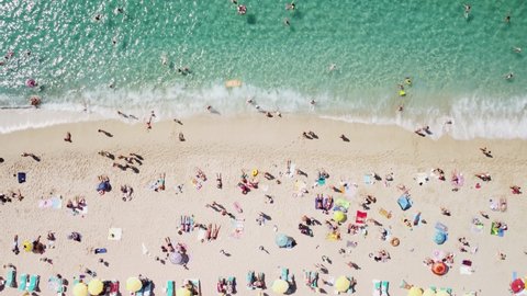 Awesome aerial view of Kleopatra Beach in Alanya, Turkey. Drone flying over the beach and the Mediterranean Sea. The coastal city is a popular tourist destination in Turkey.