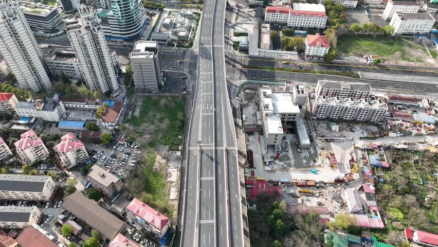 Drone aerial view of Empty Shanghai city during lockdown March 28 2022. Coronavirus, lockdown and news concept b-roll footage. No people and traffic in the road during the first day of Pudong lockdown Royalty-Free Stock Footage #1089898263