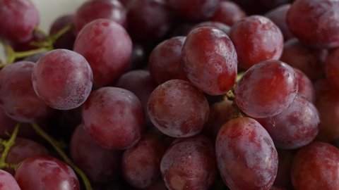 Close up view 4k video footage of red seeded organic grapes raisins. Fruits of Chile. Grapes video background