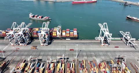 Rotterdam, 18th of april 2022, The Netherlands. Container terminal logistic ship loading and unloading of import and export dock commercial harbour aerial drone view. freight business