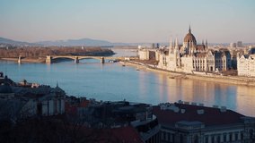 parliament in budapest with views of the river and bridges