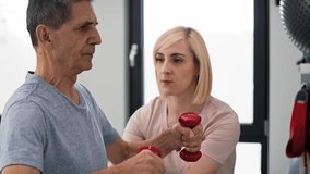 Caucasian senior man working with therapist. Shot with RED helium camera in 8K