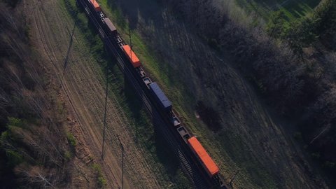 Shipping containers transportation on freight train by railway. Cargo Containers On Railroad. Intermodal Container On Train Car. Rail Freight Shipping Logistics. Multimodal Freight Transportation.