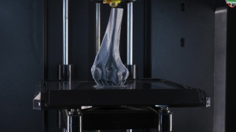 Modern technologies, 3d printer prints human bone model, the process of printing prosthetic leg joint on a 3d printer, timelapse.