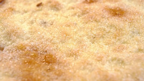 Pita bread with sugar. Olive oil flatbread texture close up. Macro. Rotation