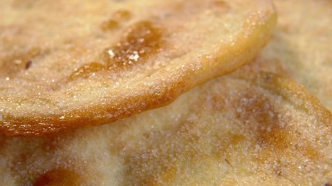 Sweet baked flatbread with sugar. Olive oil pita breads. Macro. Rotation