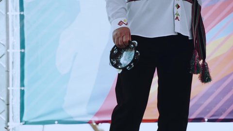 Close-up of the game on the tambourine