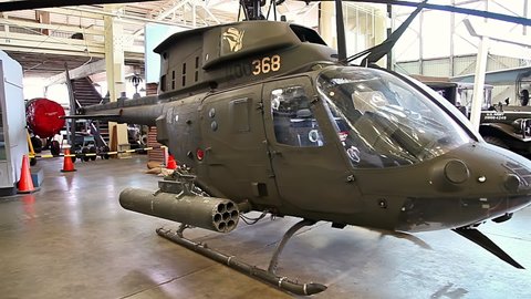 Honolulu, Oahu, Hawaii, United States - August 2016: helicopter BELL OH-58D Kiowa Warrior of 1980s in Hangar 79 of the Pearl Harbor Aviation Museum of Hawaii. Served in Somalia, Bosnia, Kosovo Wars.