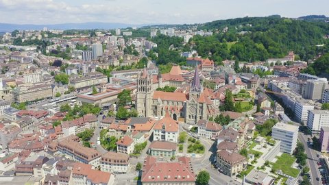 Inscription on video. Lausanne, Switzerland. Cathedral of Lausanne. La Cite is a district historical centre. Shimmers in colors purple, Aerial View, Point of interest