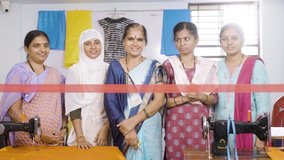 Indian woman starting new garments or tailoring small business by ribbon cutting while workers clapping from behind - concept of inspiration, diversity and empowerment. - Powered by Shutterstock - Get 15% off with code: PIKWIZARD15