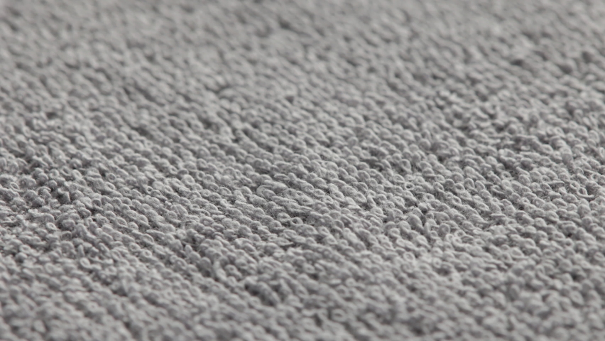 Closeup loopable full-frame background of gray soft cotton towel | Shutterstock HD Video #1089918229
