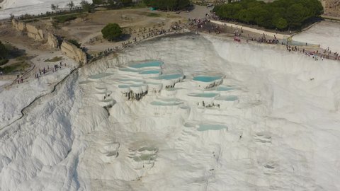 Pamukkale (Cotton Castle), ancient Hierapolis (Holy City), which was declared the world heritage site by UNESCO. Aerial view of Travertines with turquoise water in Pamukkale, Turkey.