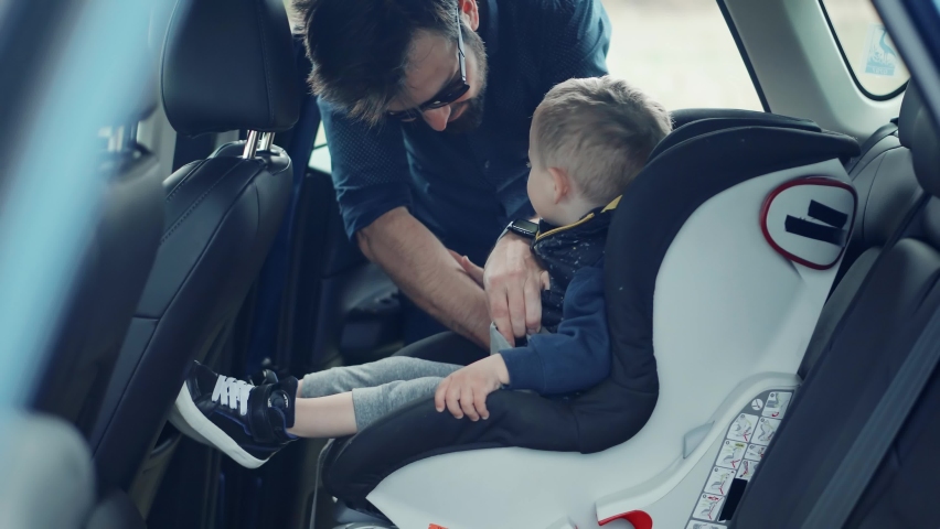 Happy Family Father And Child Boys Leisure. Father Fasten Son In Car Seat. Carefree Dad Baby Seat Sons Auto Trip Adventure. Family Parent Holidays Relationship. Car Baby Seat With Safety Seatbelt Trip Royalty-Free Stock Footage #1089921387