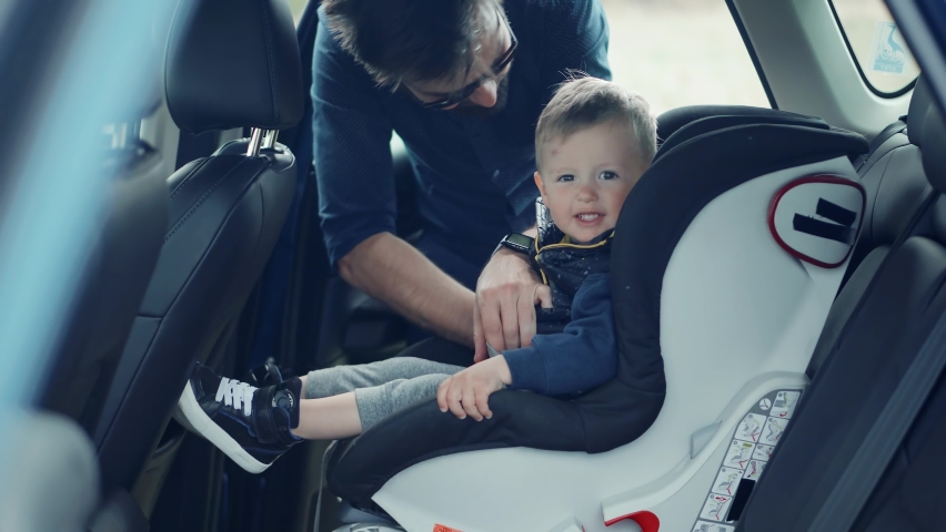 Happy Family Father And Child Boys Leisure. Father Fasten Son In Car Seat. Carefree Dad Baby Seat Sons Auto Trip Adventure. Family Parent Holidays Relationship. Car Baby Seat With Safety Seatbelt Trip Royalty-Free Stock Footage #1089921387