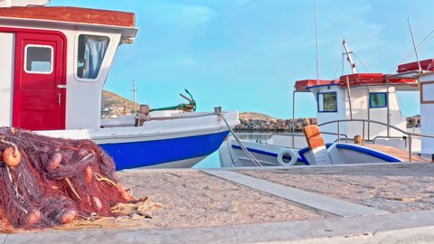 Traditional fishing boats in harbor of Paros island in Greece. Greek lifestyle