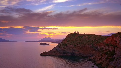 Ancient Greek temple of Poseidon at sunset on cape Sounion Athens Greece