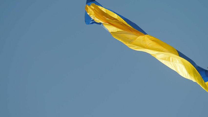 Highly detailed fabric texture flag of Ukraine. Slow motion of Ukraine flag waving background sky blue and yellow national color Ukrainian yellow-blue. Ukraine flag wind waving national symbol Royalty-Free Stock Footage #1089923325