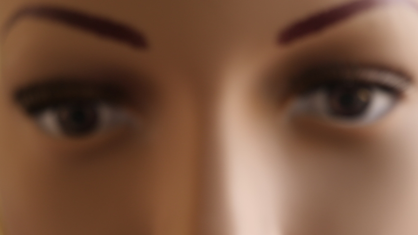 Close up of mannequin face. Camera zooms in on eyes.