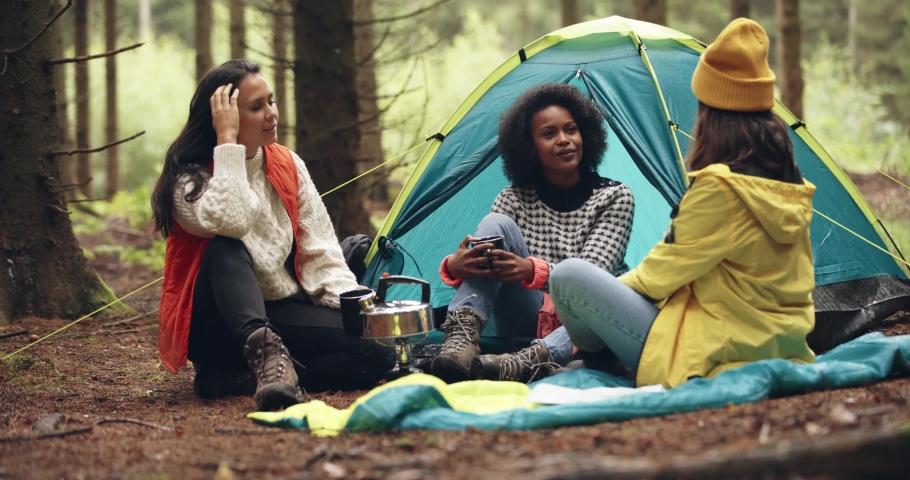 Friends drinking coffee at their 
campsite Royalty-Free Stock Footage #1089923661