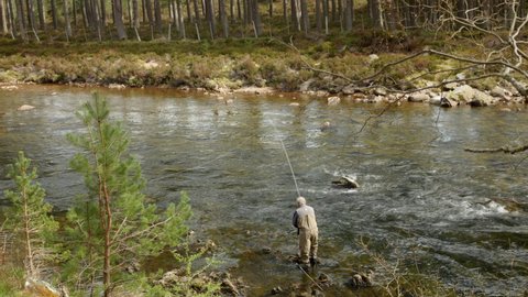 2nd,May, 2022, Ballater, Scotland. A salmon fisherman fishing on the River Dee near the queens Balmoral residence.