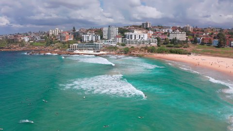 Sydney Australia Bondi beach aerial view. Ocean waves and surfers on sea waves