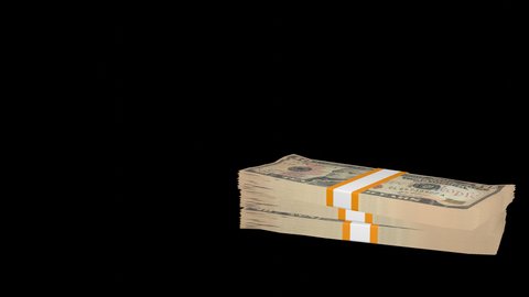 Many wads of money falling down on transparent background. 10 US dollar banknotes. Stacks of money. Financial and business concept. Alpha channel.